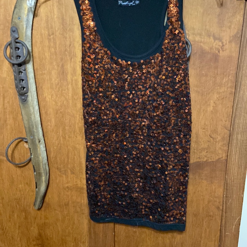 Size medium sequins top fits like small